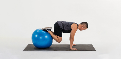 take-your-planks-to-the-next-level-with-the-stability-ball-knee-tuck